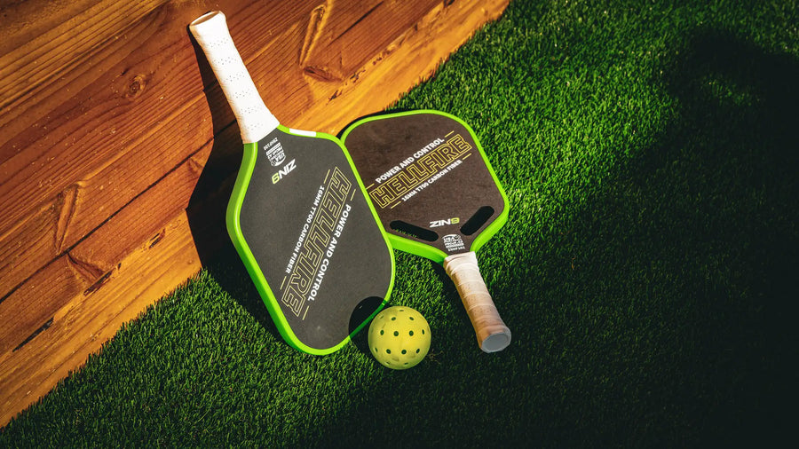 Two Hellfire paddles and a ZIN9 ball on turf